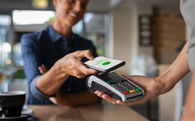 Woman paying using NFC technology